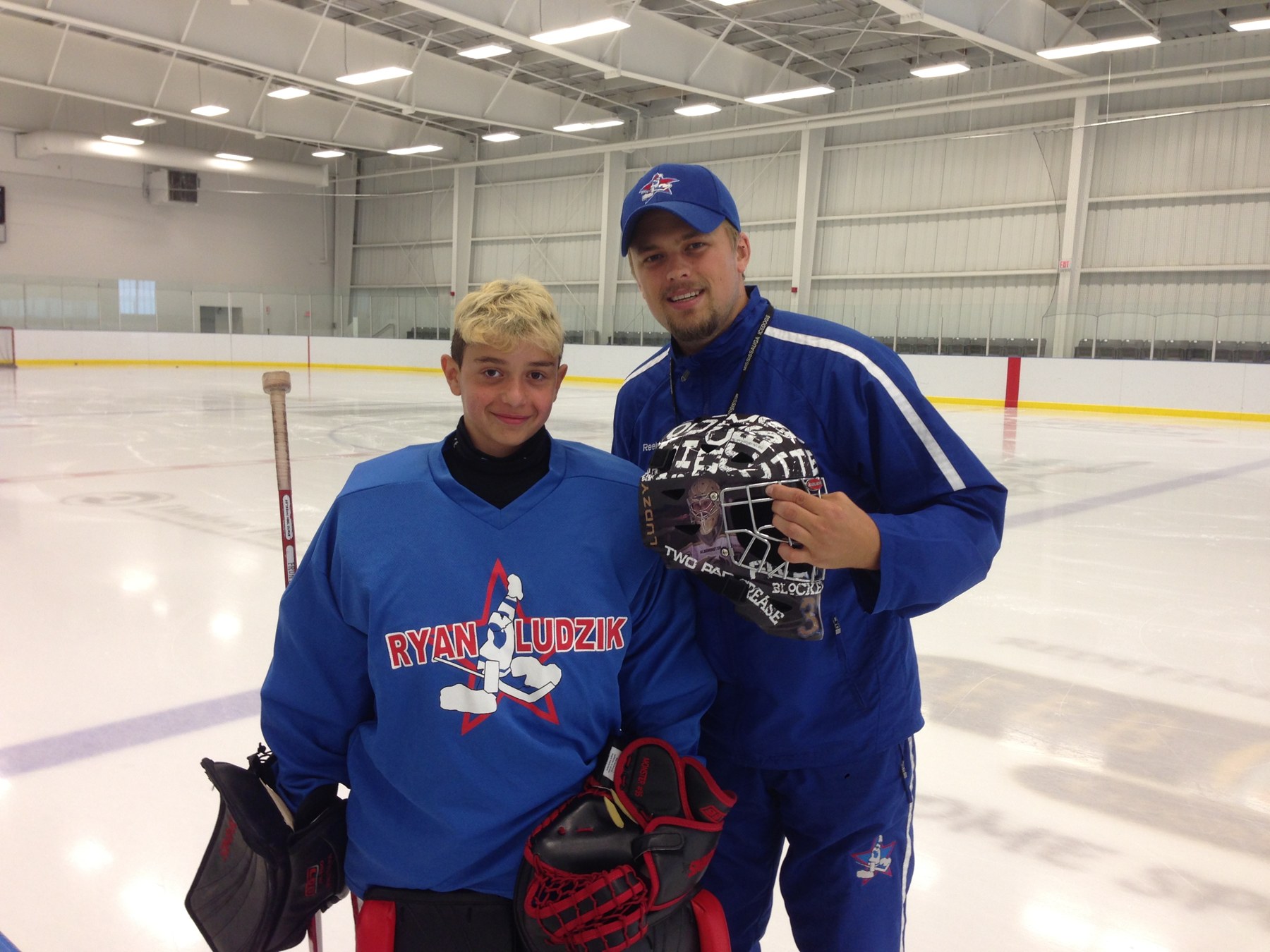 Ryan Ludzik on the ice with one of his goalies